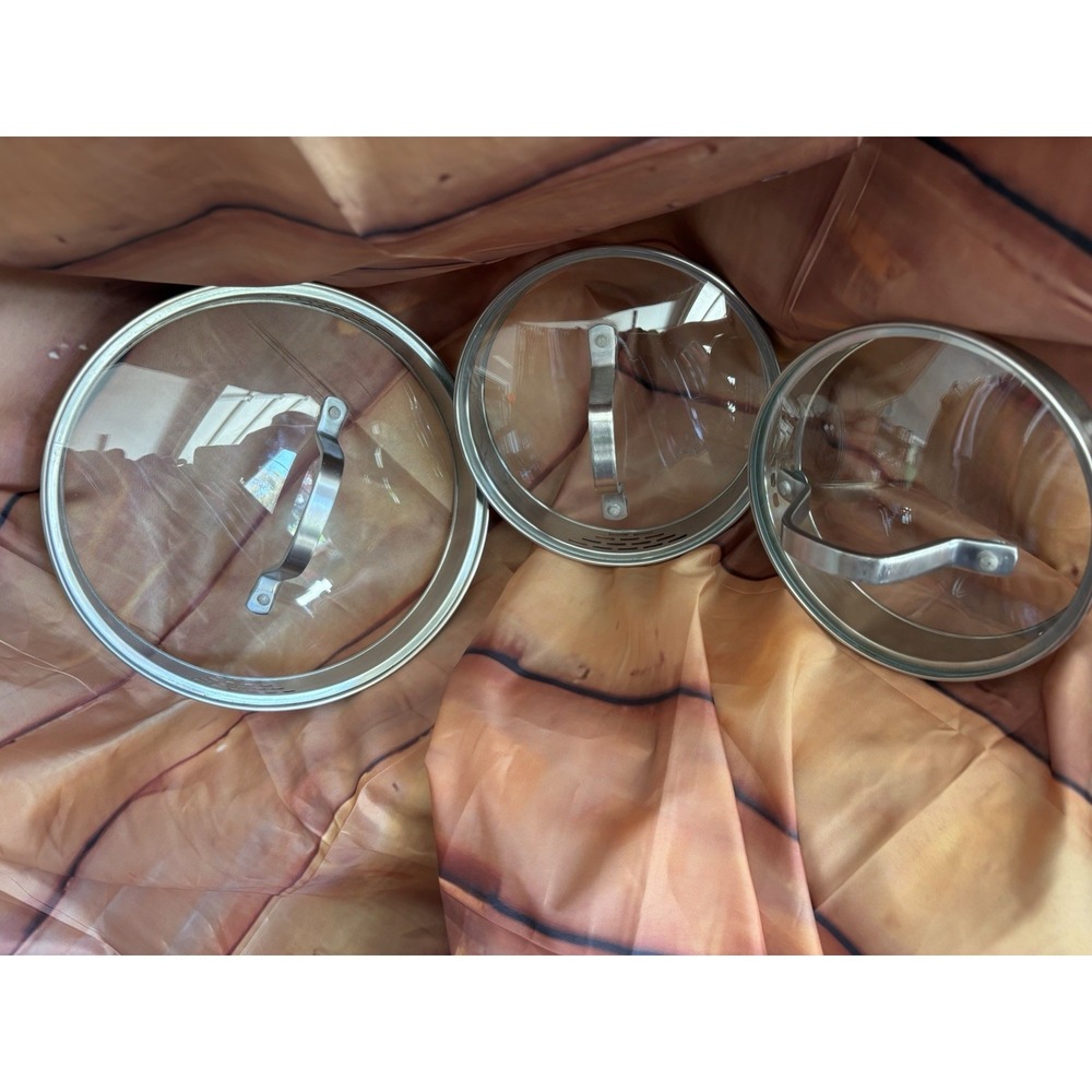 Preowned Lot of Three Calphalon Glass Lids with Strainers and Handles